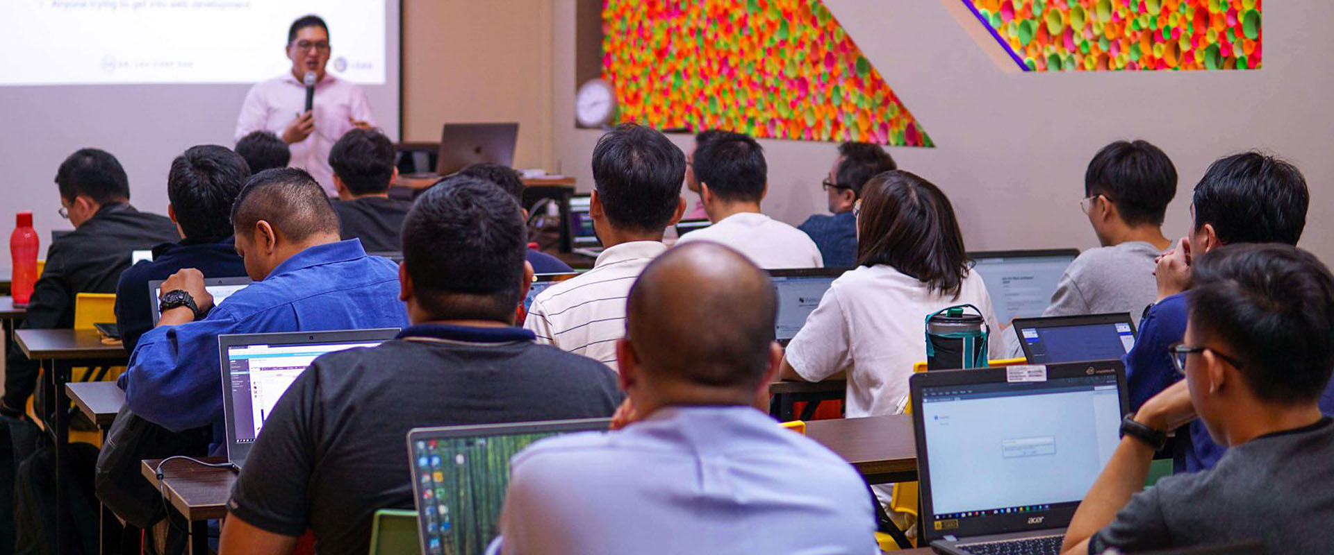 Dr. Lau teaching a full classroom at AI365 Hub, Oval Damansara